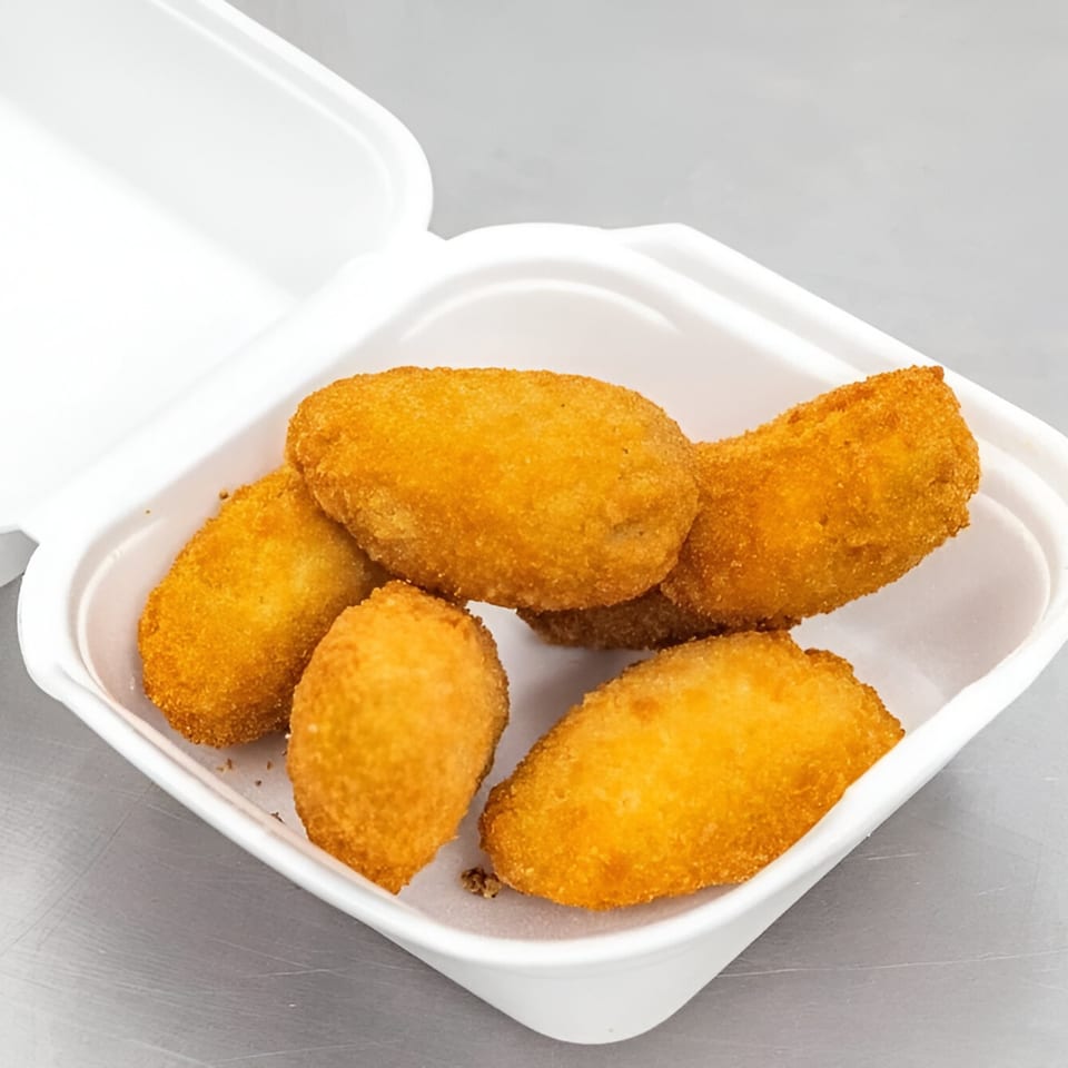 Five golden-brown fried jalapeno poppers in a white styrofoam takeout container from Sunrise Fish And Chicken.
